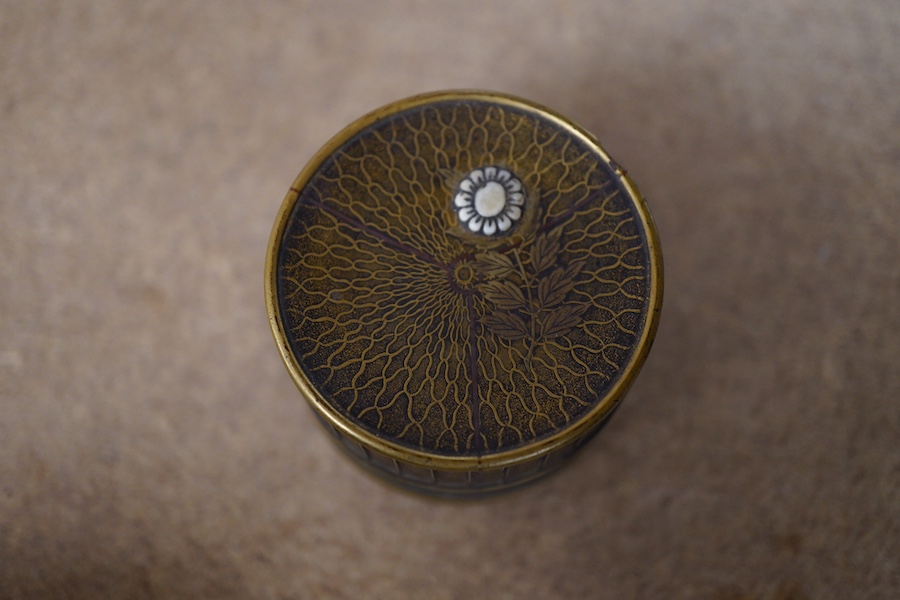 A Japanese miniature cylindrical lacquer box, 19th century, with applied carved ivory flower, 4.5cm in diameter. Condition - one interior section missing CITES Submission reference Z9FUK266